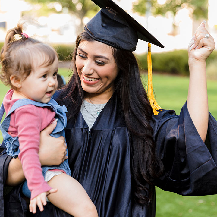 a graduating woman and her baby