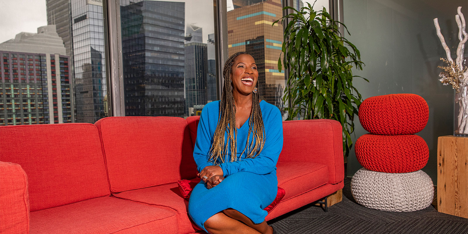 Crystal Barnes on a red couch