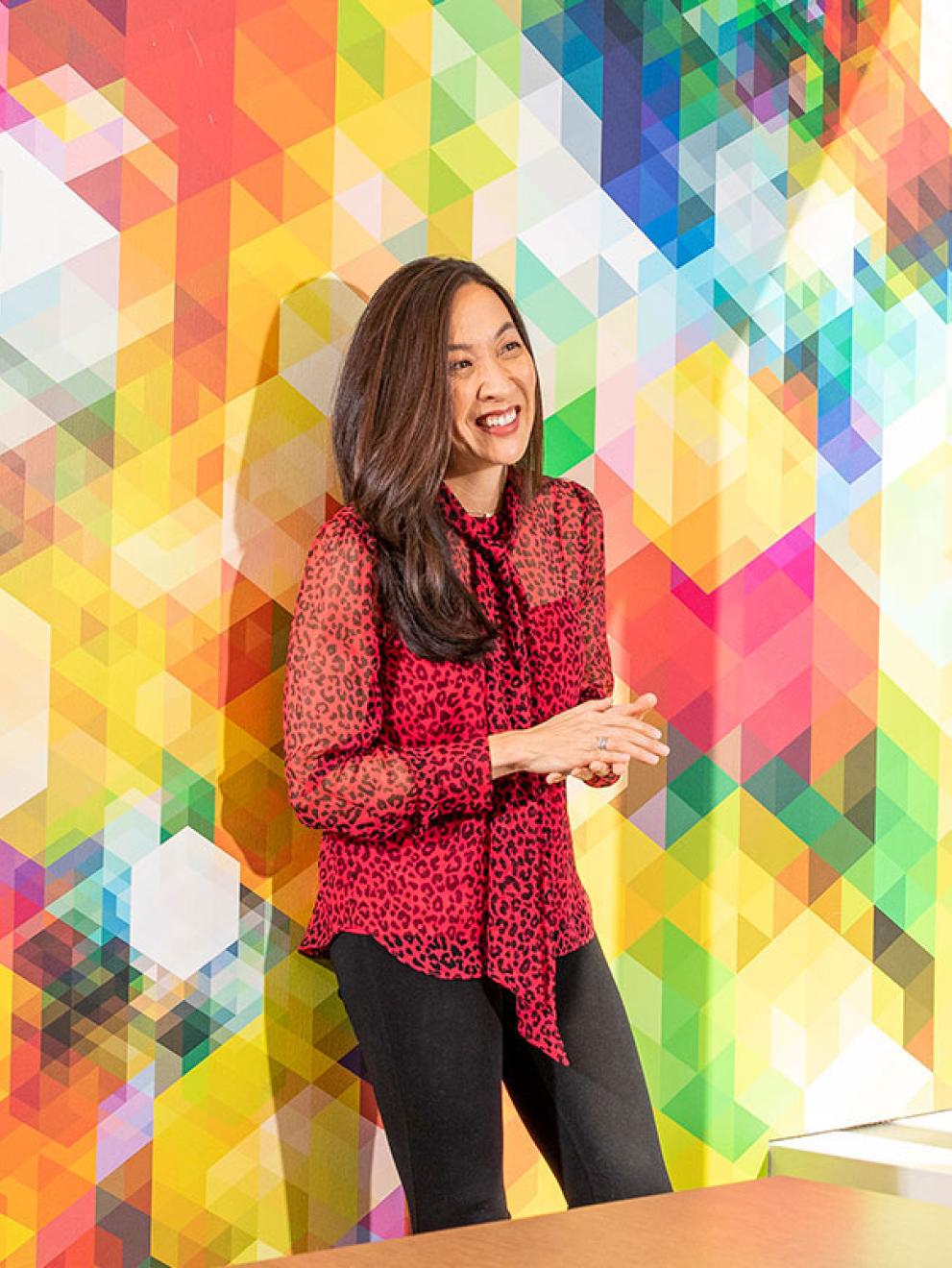 Katherine Liu against colorful wall