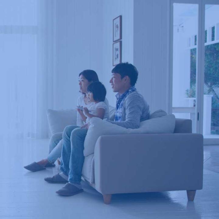 A family watching tv together  