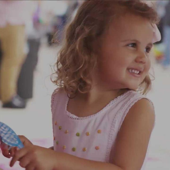 Little girl playing with a doll