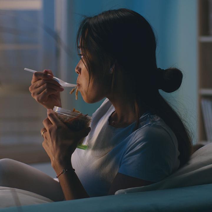 A woman watching TV